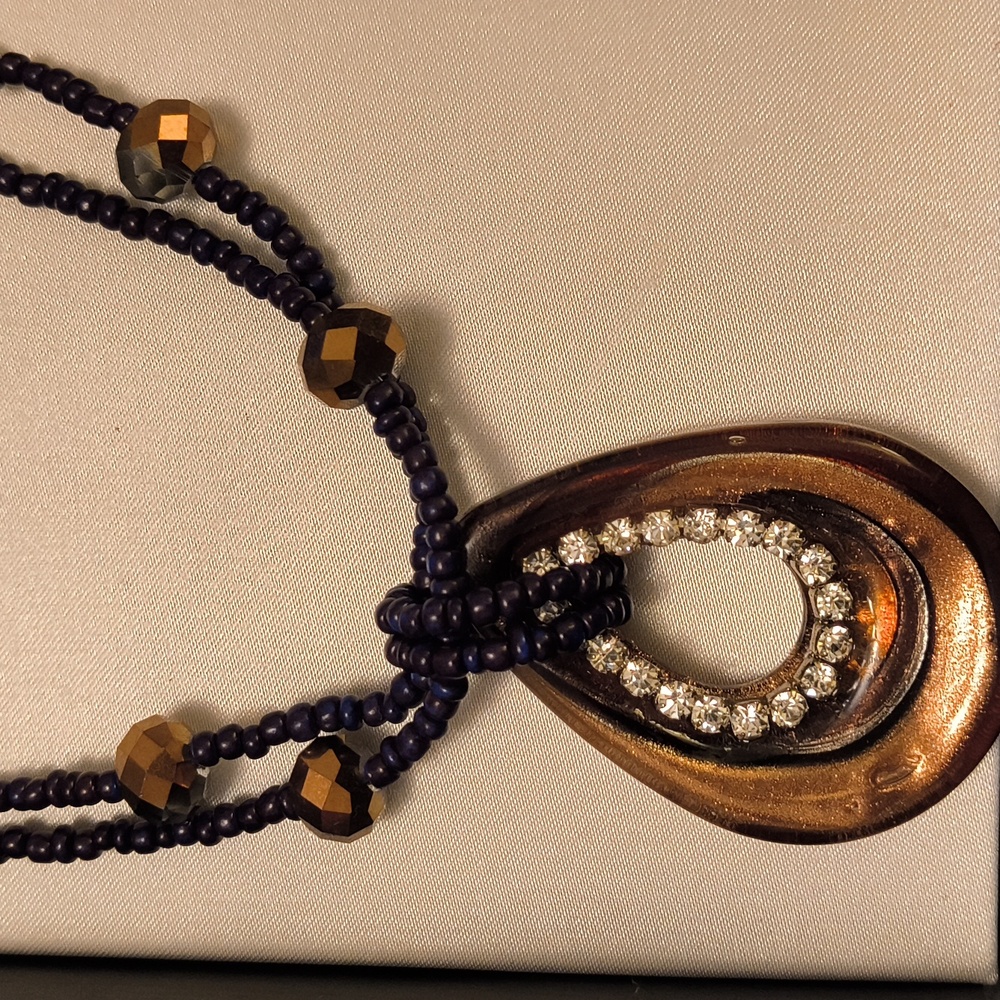 A beautiful brown and silver tone necklace and earring set. Jules F. Vintage set